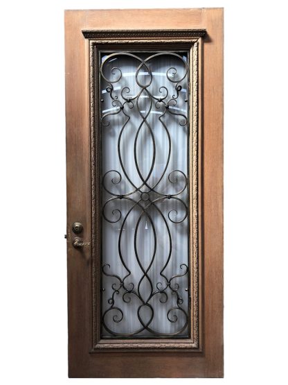 Vintage Entry Door With Wrought Bronze Grill