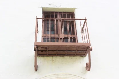 Historic 1911 Iron Balconies With Spiral Baluasters Scrolled Brackets